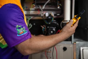 hvac tech carlos reyes checking a furnace